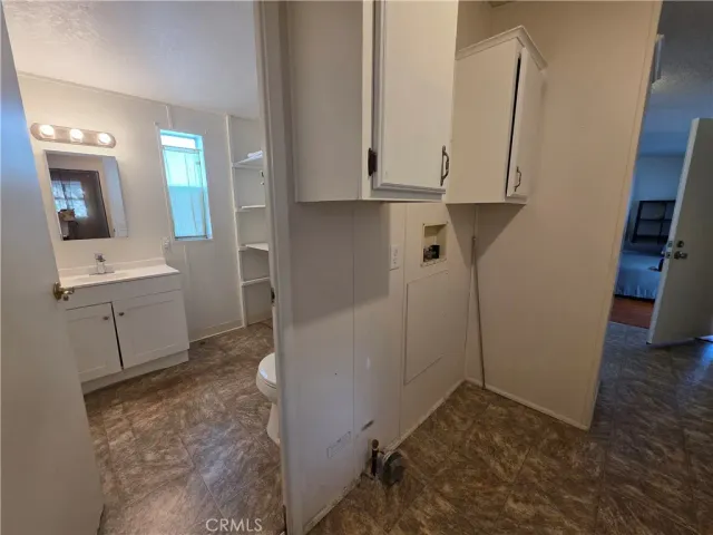 a bathroom with a sink and mirror