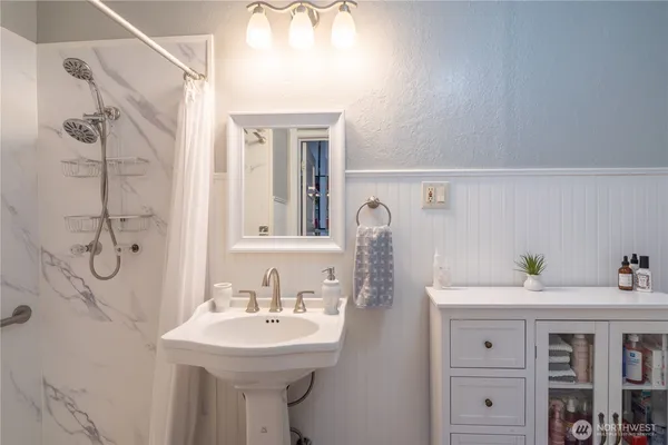 a bathroom with a sink and a mirror