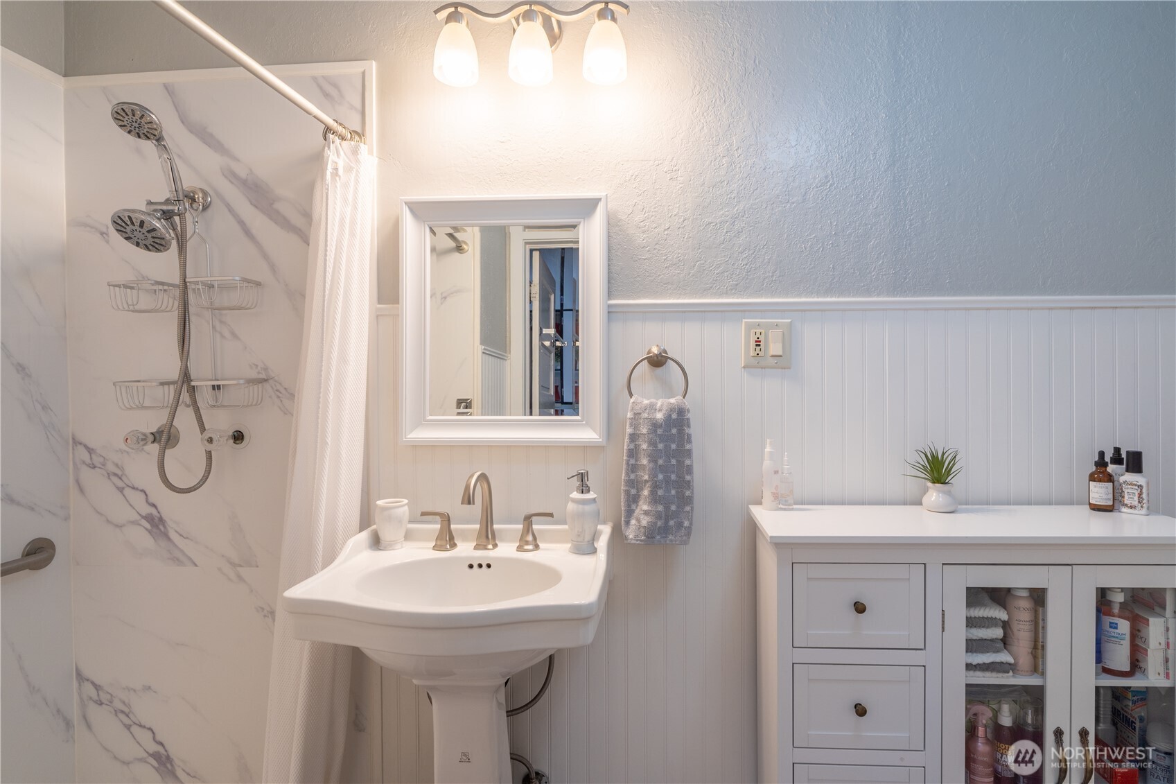 102 West 3rd Street Lind, WA 99341 - Photo 15 of 27 a bathroom with a sink and a mirror