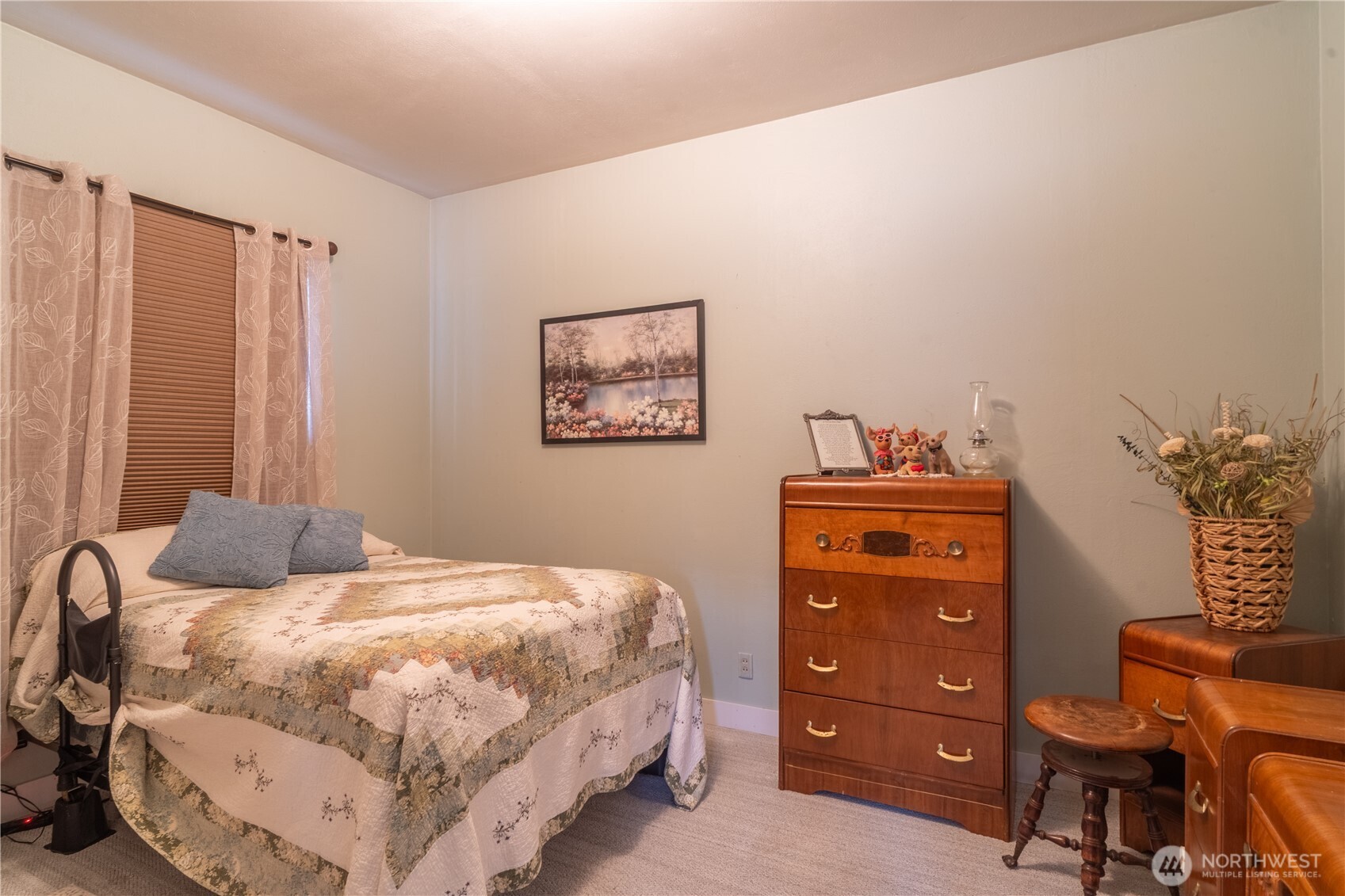 102 West 3rd Street Lind, WA 99341 - Photo 19 of 27 a bedroom with a bed a lamp and a closet