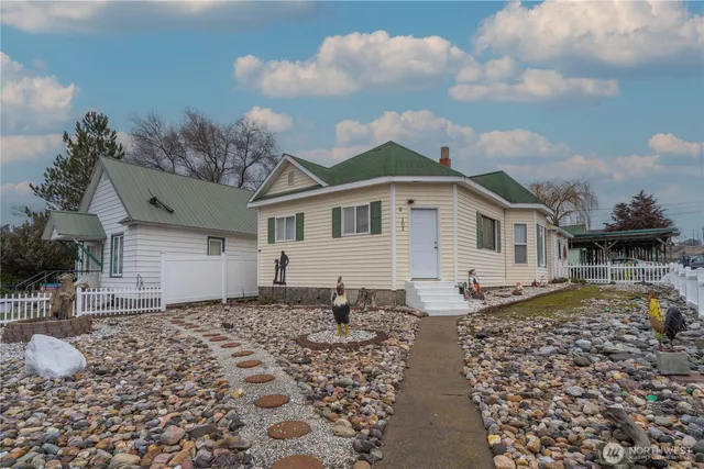 a front view of a house with garden