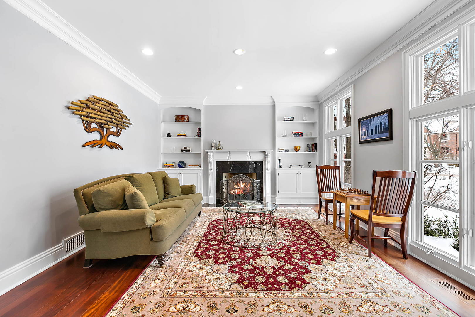 594 Willow Road Winnetka, IL 60093 - Photo 13 of 41 a living room with furniture and a fireplace