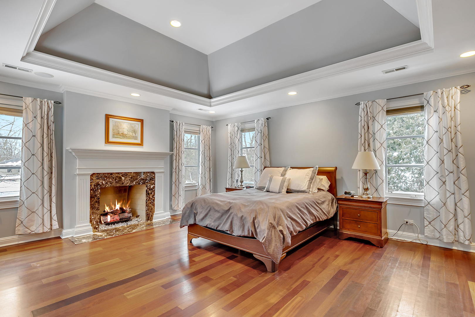 594 Willow Road Winnetka, IL 60093 - Photo 19 of 41 a bedroom with a bed and a fireplace