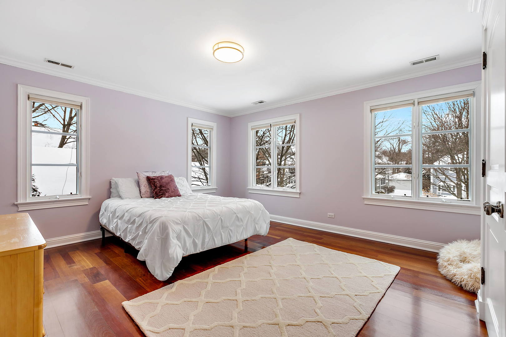 594 Willow Road Winnetka, IL 60093 - Photo 23 of 41 a bedroom with a large bed and a window