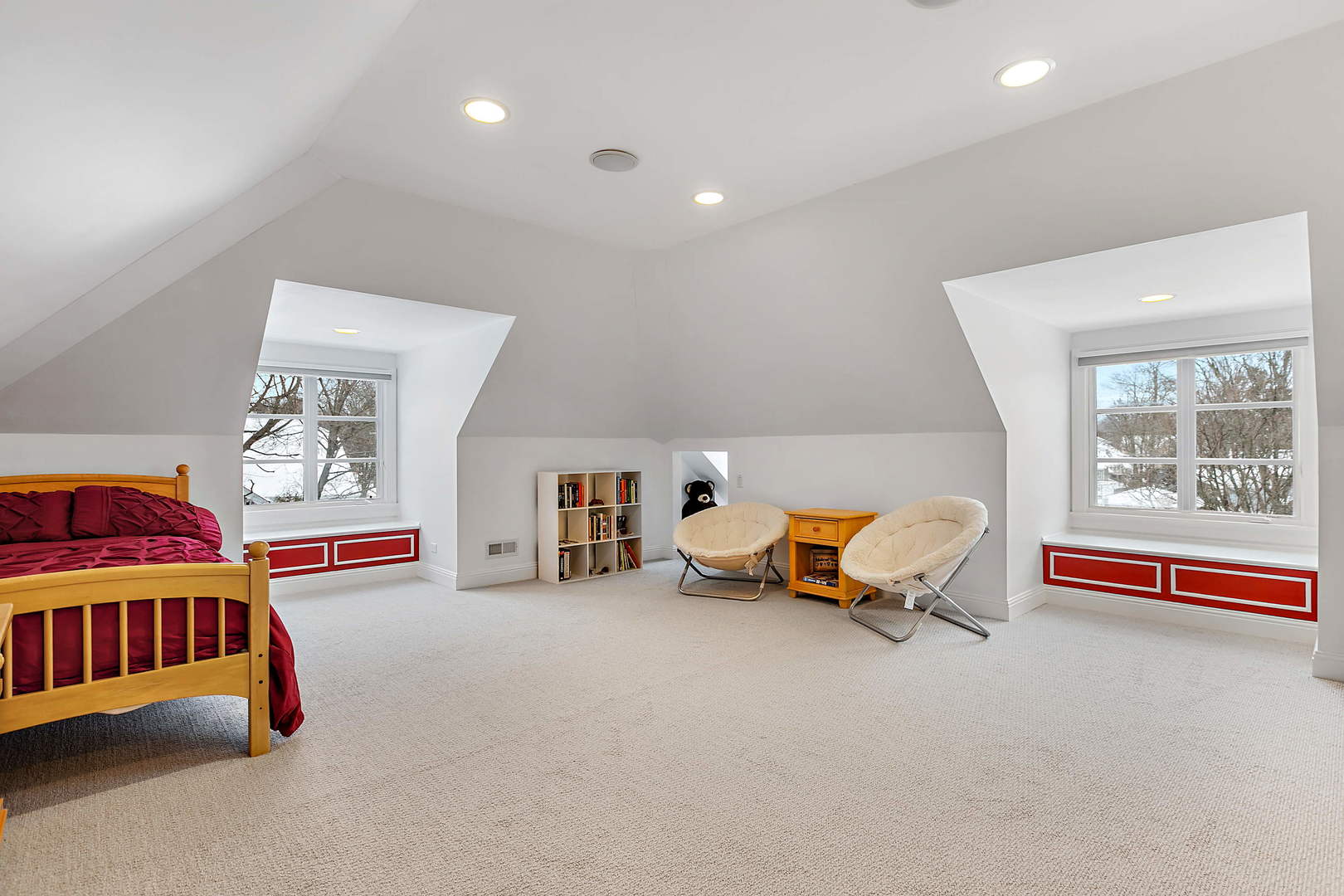 594 Willow Road Winnetka, IL 60093 - Photo 26 of 41 a bedroom with furniture and a book shelf