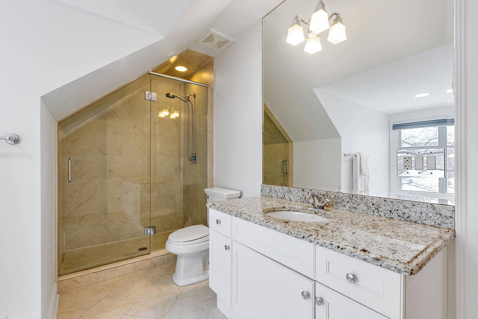 594 Willow Road Winnetka, IL 60093 - Photo 27 of 41 a bathroom with a granite countertop sink a toilet and shower