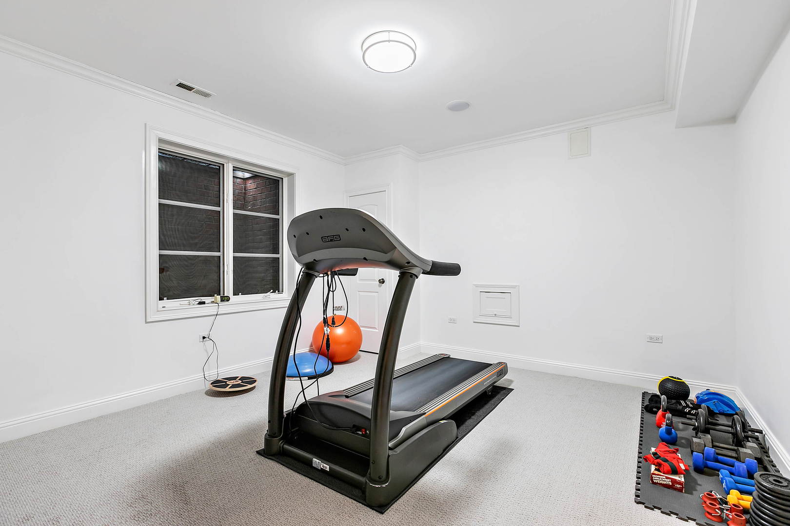 594 Willow Road Winnetka, IL 60093 - Photo 30 of 41 a room with furniture and a window