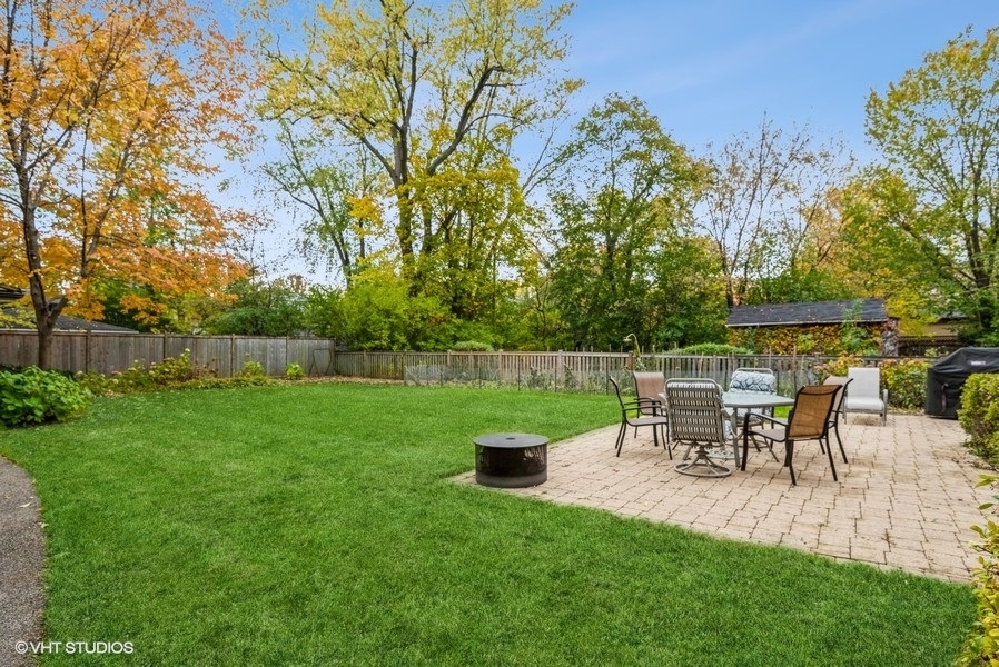 594 Willow Road Winnetka, IL 60093 - Photo 33 of 41 a view of a table and chairs in the garden
