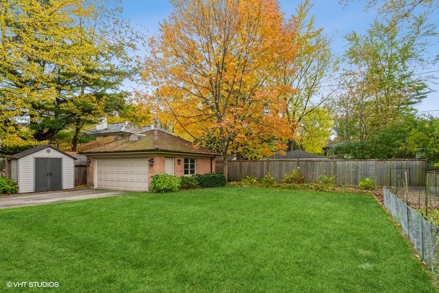 594 Willow Road Winnetka, IL 60093 - Photo 34 of 41 a white house with a big yard plants and large trees