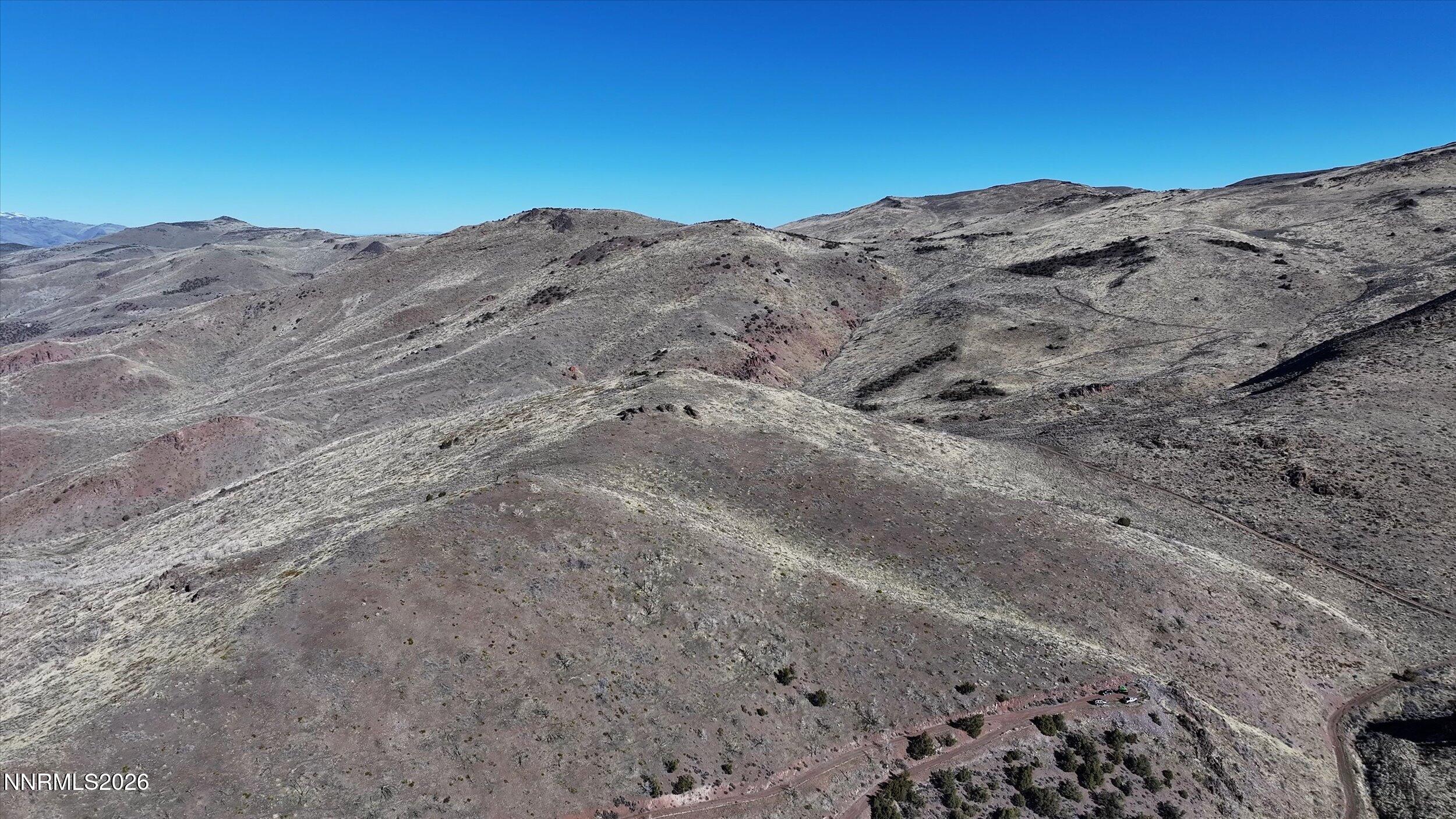 0 Wrangler Road, Unit 9 Reno, NV 89510 - Photo 6 of 9 a view of a dry yard with mountains in the background