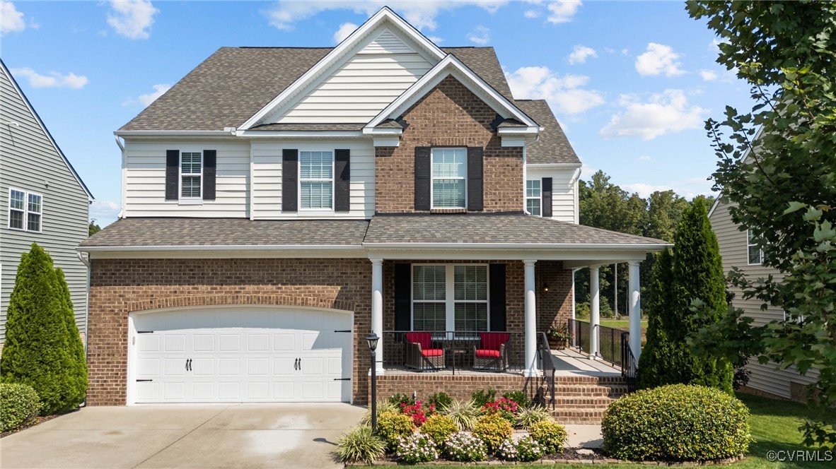 906 Agee Terrace Midlothian, VA 23114 - Photo 1 of 48 a front view of a house with a yard