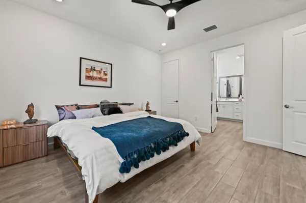 a bed room with a bed and a desk