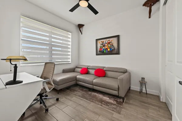 a living room with furniture and a window