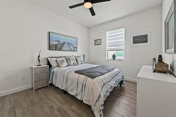 a bedroom with bed and window