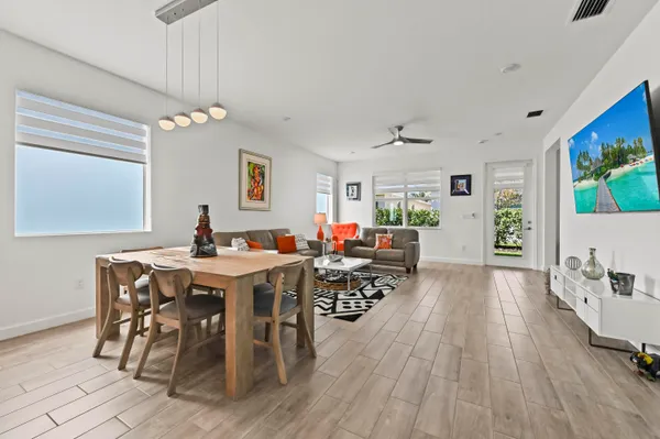 a view of a dining room with furniture window and wooden floor