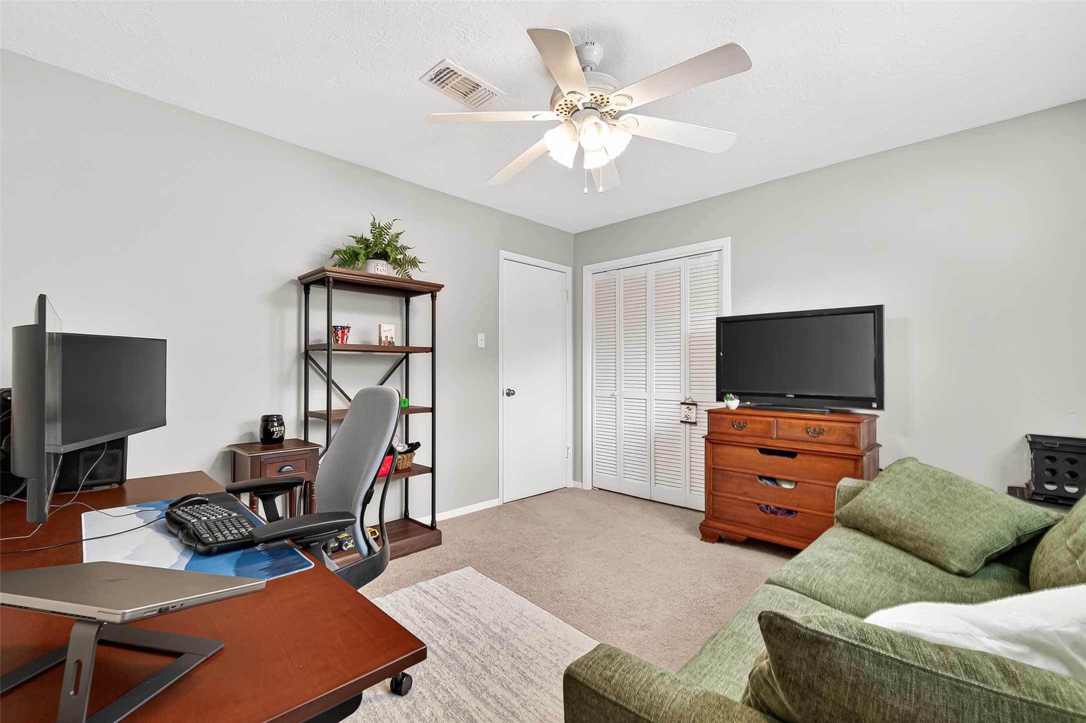 17611 Sorrell Ridge Drive Spring, TX 77388 - Photo 36 of 50 a living room with furniture and a flat screen tv