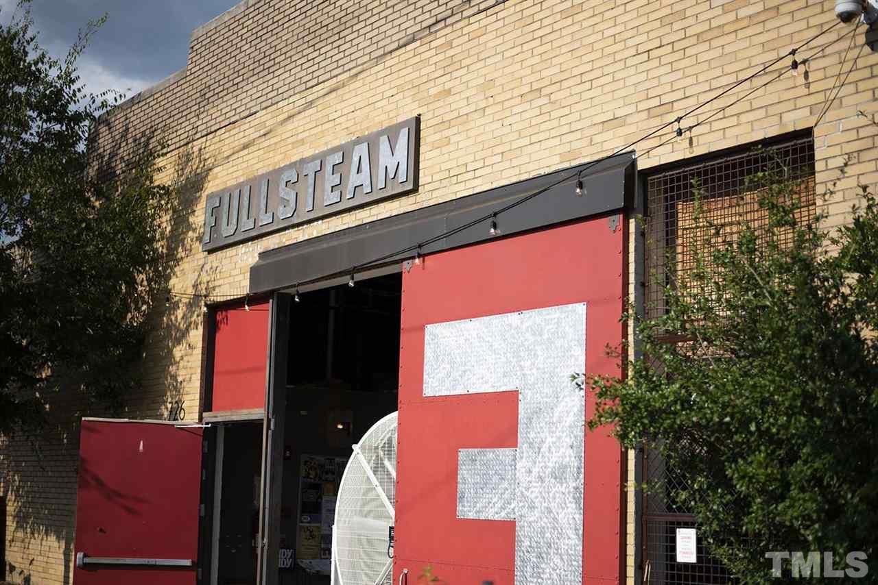 518 North Roxboro Street Durham, NC 27701 - Photo 13 of 20 a street sign on a street corner