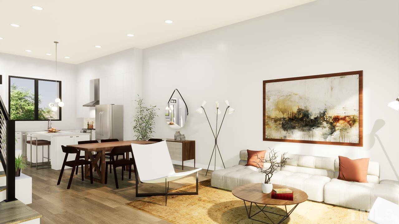 518 North Roxboro Street Durham, NC 27701 - Photo 4 of 20 a living room with furniture and a large window