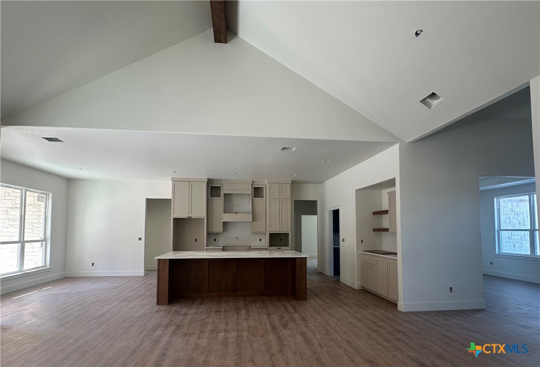 7063 Troyan Lane Temple, TX 76502 - Photo 11 of 28 a view of kitchen with refrigerator stove and wooden floor