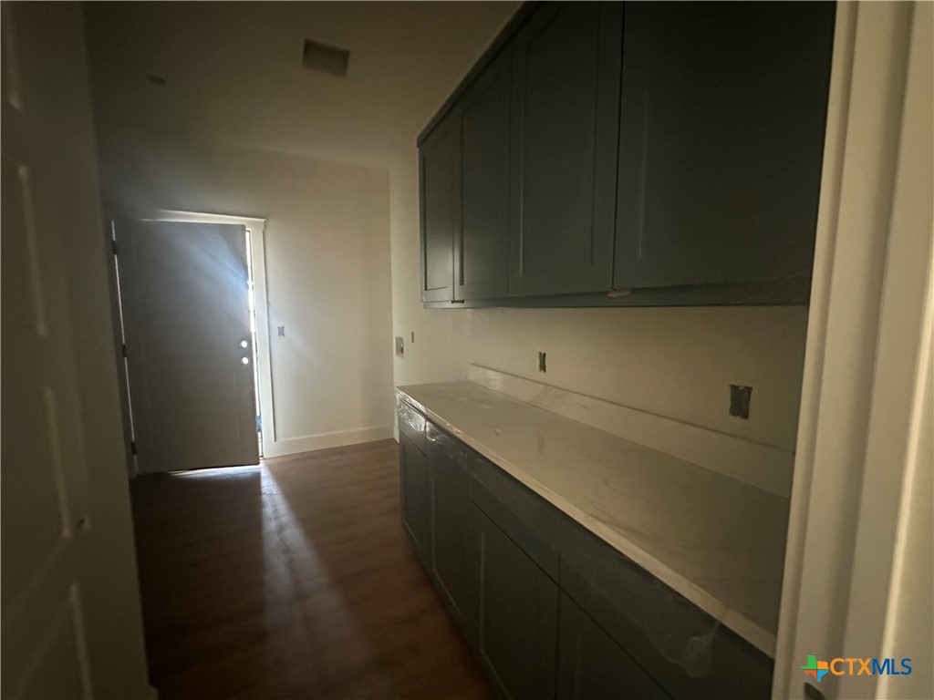 7063 Troyan Lane Temple, TX 76502 - Photo 22 of 28 a kitchen with a sink and cabinets