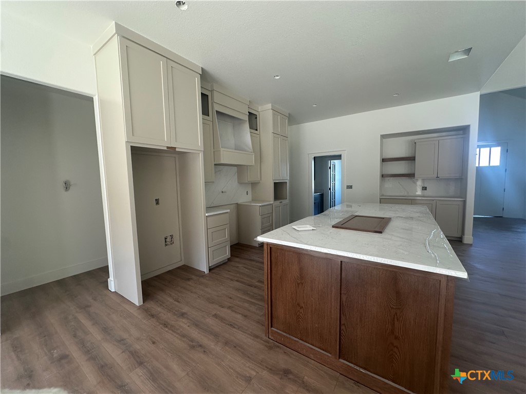 7063 Troyan Lane Temple, TX 76502 - Photo 9 of 28 a kitchen with a stove a refrigerator and a sink