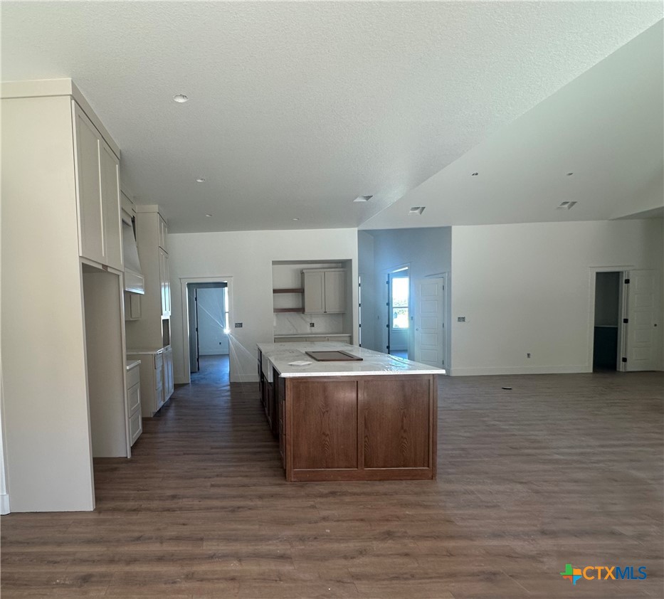 7063 Troyan Lane Temple, TX 76502 - Photo 10 of 28 a view of a kitchen with a sink wooden cabinets and entryway