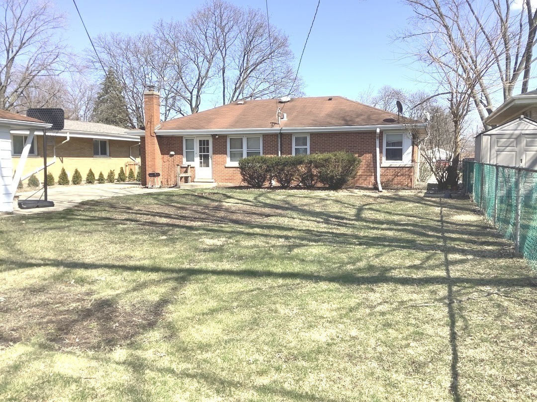 510 High Ridge Road Hillside, IL 60162 - Photo 2 of 4 a front view of a building with a garden