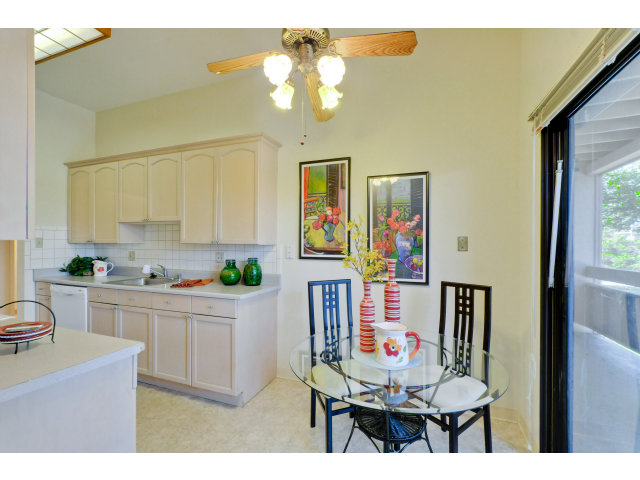 1111 Compass Lane, Unit 204 Foster City, CA 94404 - Photo 2 of 13 a living room with kitchen island furniture and a chandelier