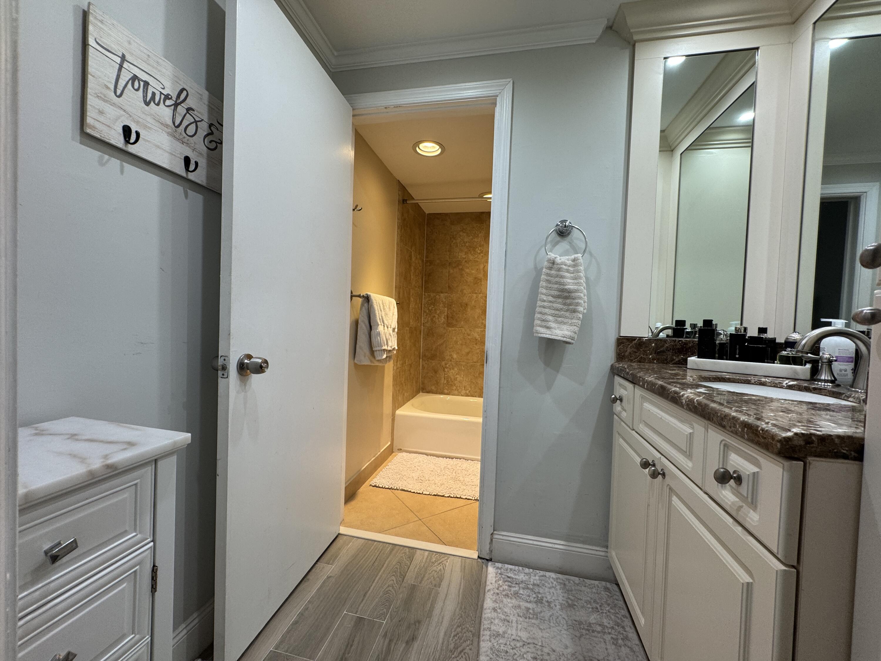 2871 North Ocean Boulevard, Unit R248 Boca Raton, FL 33431 - Photo 13 of 44 a bathroom with a granite countertop sink and a mirror