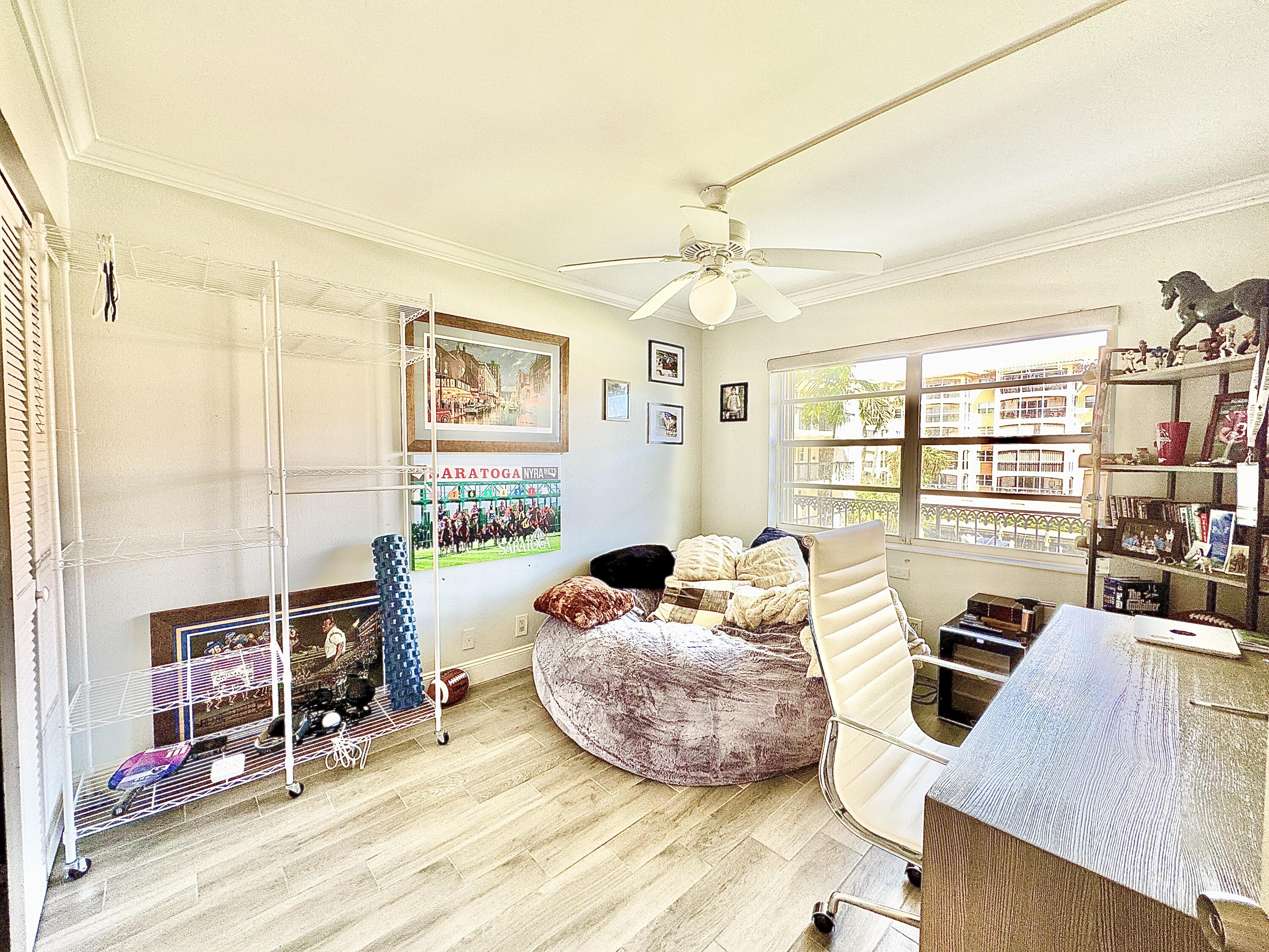 2871 North Ocean Boulevard, Unit R248 Boca Raton, FL 33431 - Photo 15 of 44 a living room with furniture and a flat screen tv