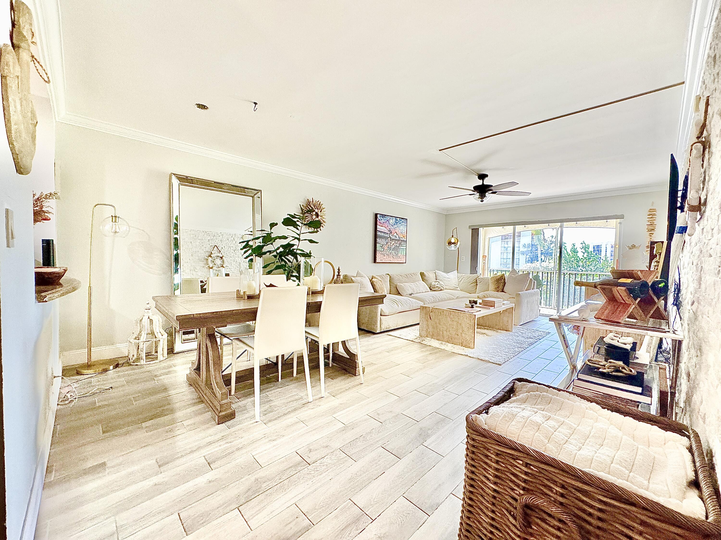 2871 North Ocean Boulevard, Unit R248 Boca Raton, FL 33431 - Photo 3 of 44 a view of a livingroom with furniture and a dining table