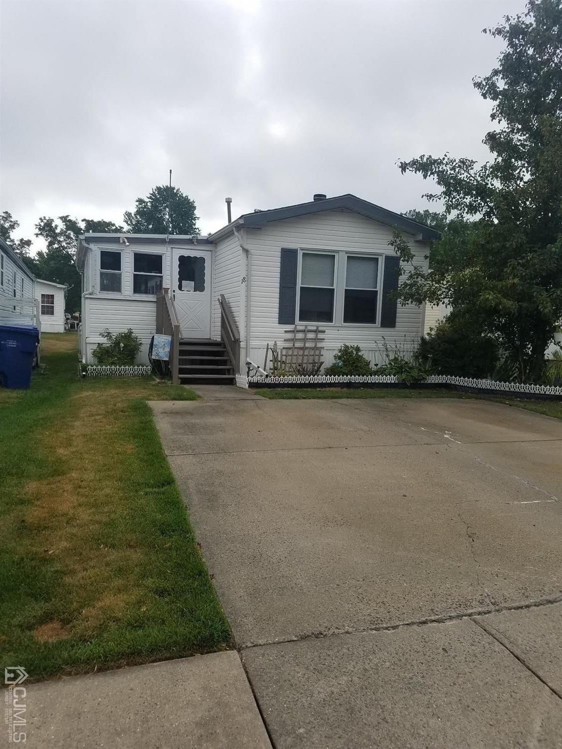 18 Twain Road North Brunswick, NJ 08902 - Photo 1 of 1 front view of a house with a yard