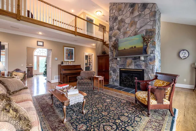 a living room with furniture fireplace and flat screen tv