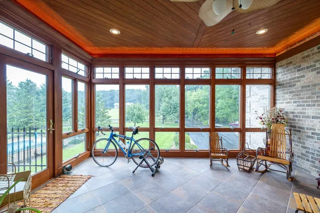 a bedroom with a bed and dresser next to a window