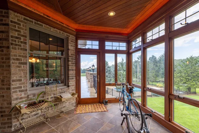 a bathroom with a double vanity sink a large mirror and a shower