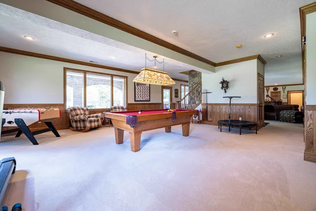 a view of a dining room with furniture window and outside view