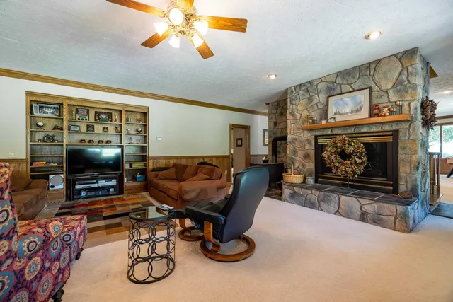 a view of a a dining room with furniture window and wooden floor
