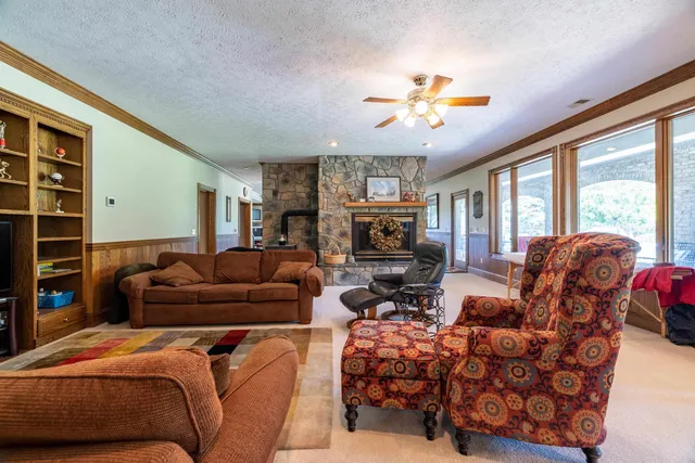 a view of an empty room with furniture and walk in closet