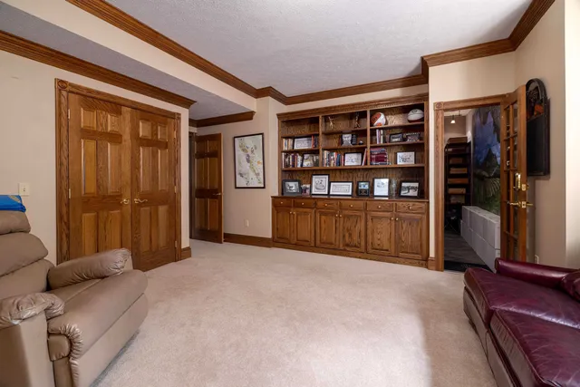 a bed room with a bed and a chair