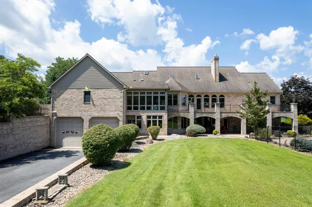 a view of an chairs and table in the patio with potted plants