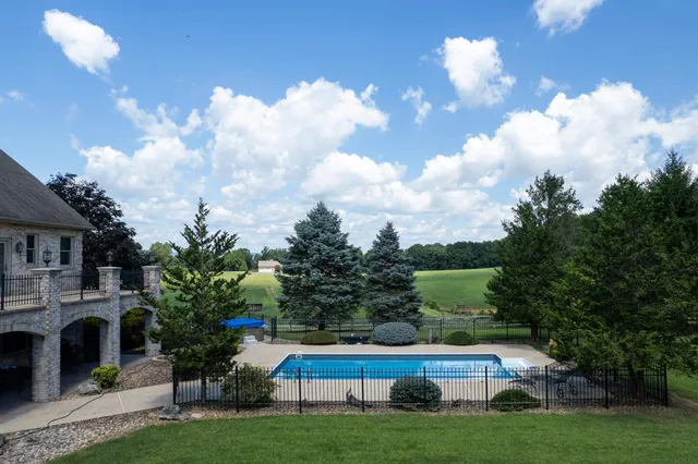 an aerial view of a house with outdoor space