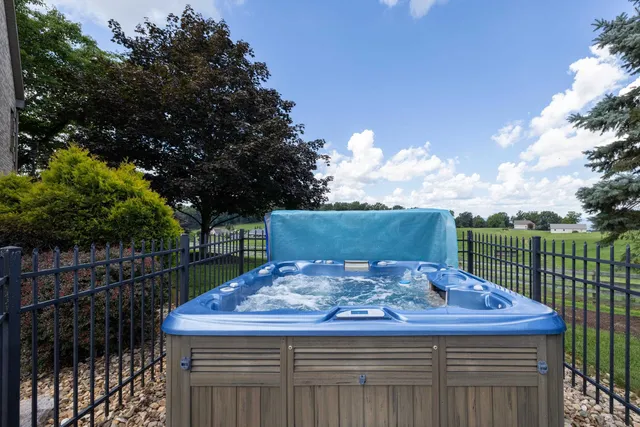 an aerial view of a houses with a yard