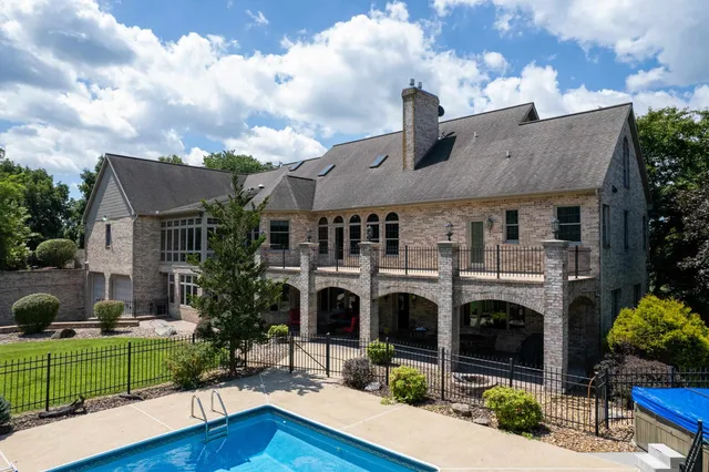 a view of a two chairs in the balcony