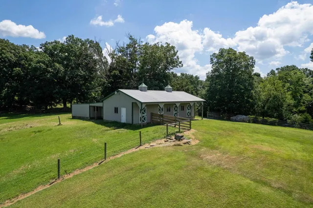 a view of hall way with furniture and entryway