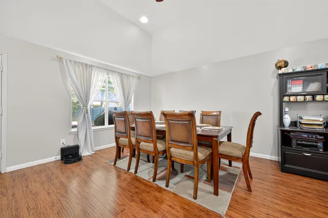 a view of a livingroom with furniture and a flat screen tv