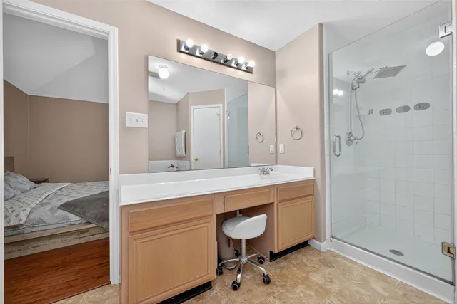 a bathroom with a sink double vanity and a mirror