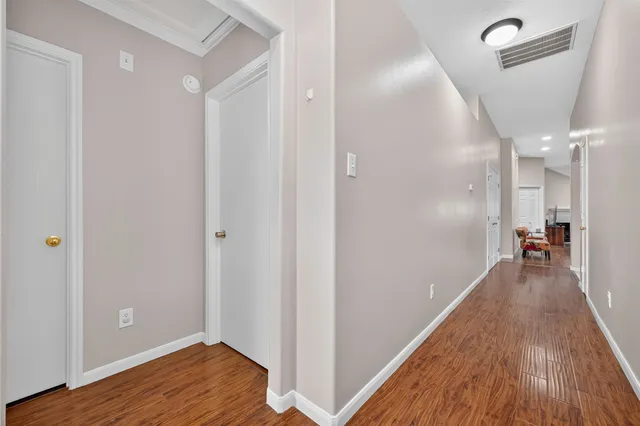 a large kitchen with a table and chairs
