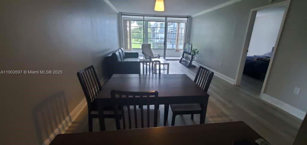 8331 Sands Point Boulevard, Unit C205 Tamarac, FL 33321 - Photo 7 of 25 a view of a a dining room with furniture window and outside view