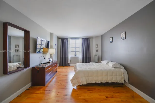 a bedroom with a bed and a table