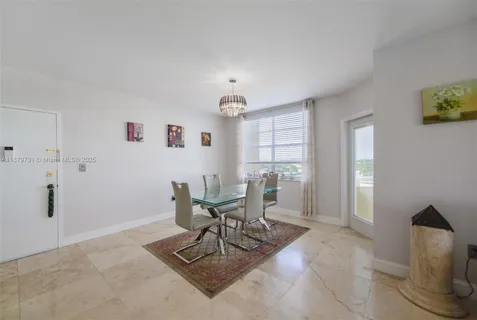 a kitchen that has a sink and a stove in it